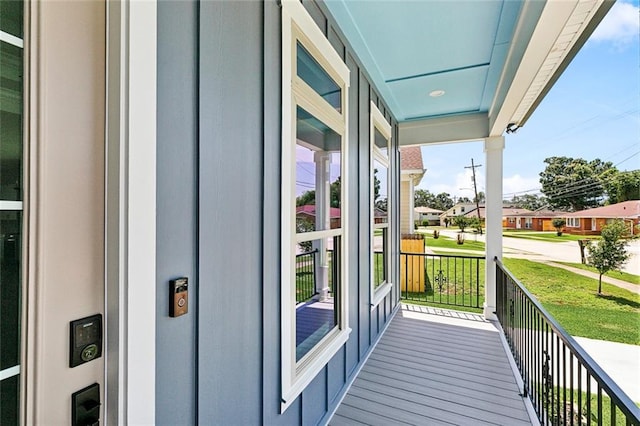 balcony with a residential view and covered porch