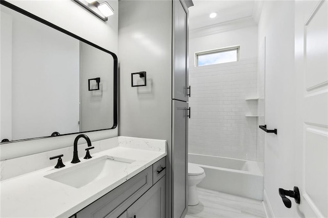 full bathroom with vanity, baseboards, crown molding, and toilet