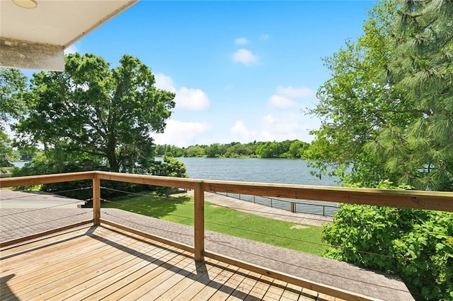 wooden deck with a water view