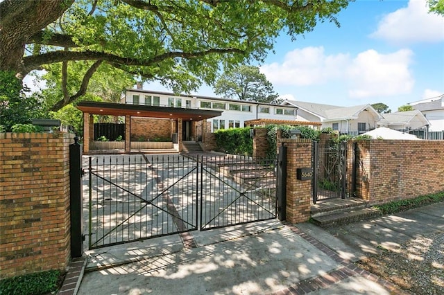 view of gate featuring a fenced front yard