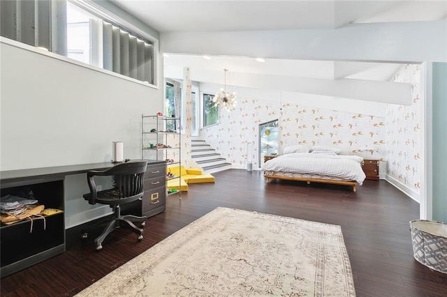 bedroom with baseboards, wallpapered walls, and wood finished floors