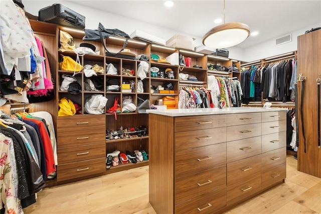 walk in closet featuring visible vents and light wood-style flooring