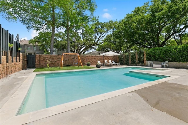 view of swimming pool with a fenced backyard, a fenced in pool, and a patio