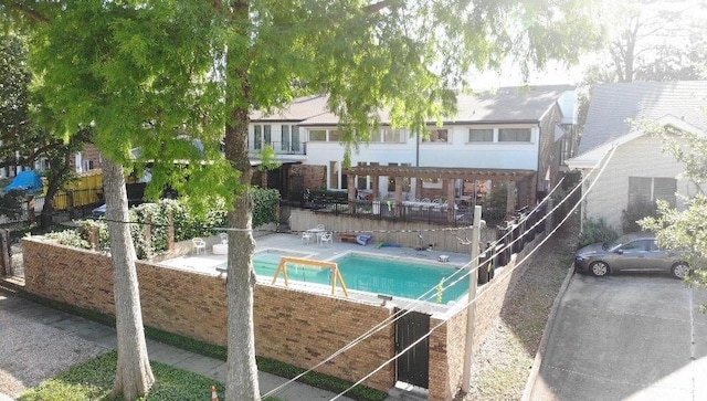 5640 Bancroft Dr, New Orleans, LA 70122 - view of swimming pool featuring fence, a pergola, and a patio