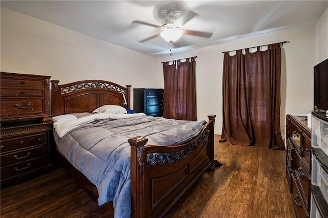 bedroom with ceiling fan and dark wood-type flooring