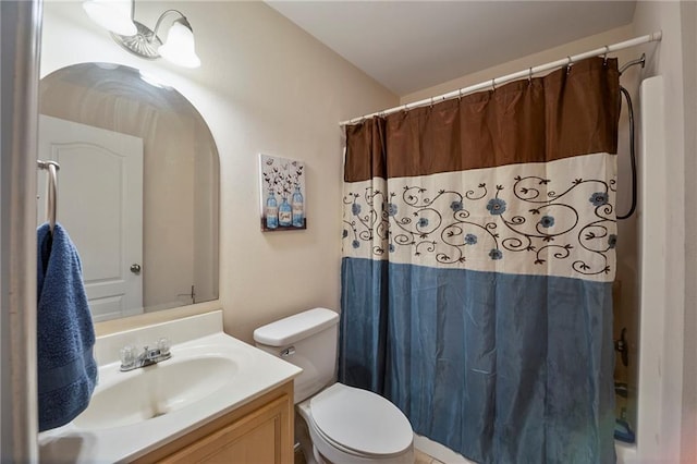 bathroom with toilet and vanity