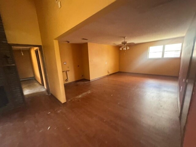 spare room featuring ceiling fan and wood finished floors