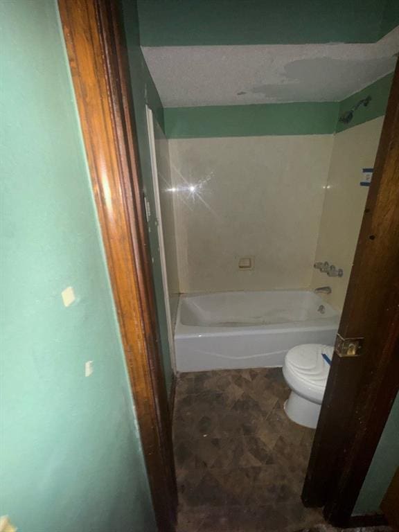 bathroom with shower / bathtub combination and toilet