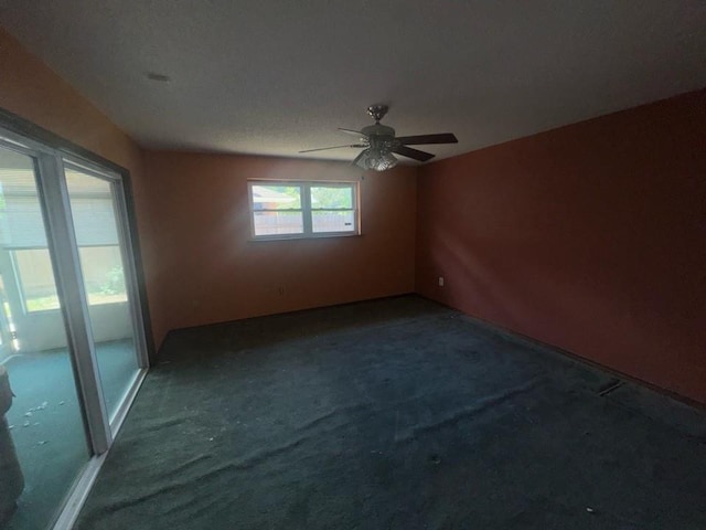 unfurnished room with carpet flooring and ceiling fan