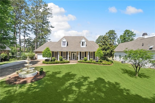 cape cod house with a porch, an attached garage, a front lawn, and aphalt driveway
