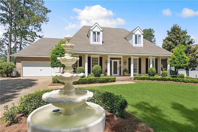 cape cod home with french doors, a front yard, aphalt driveway, an attached garage, and a shingled roof