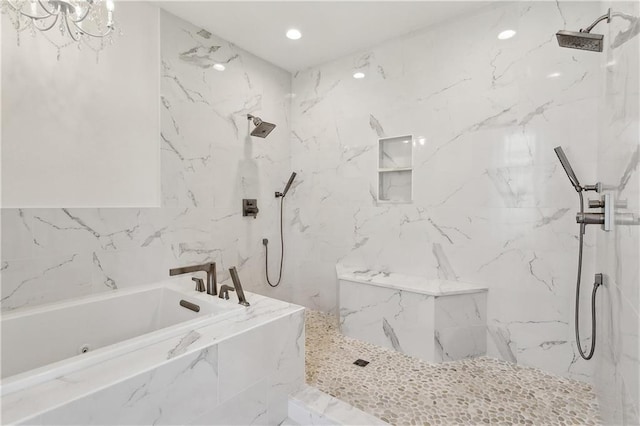 bathroom with a marble finish shower, recessed lighting, and a bath