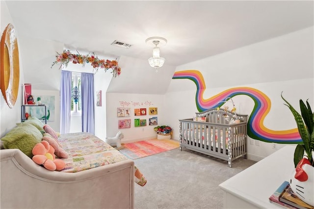 bedroom with visible vents, carpet flooring, and vaulted ceiling