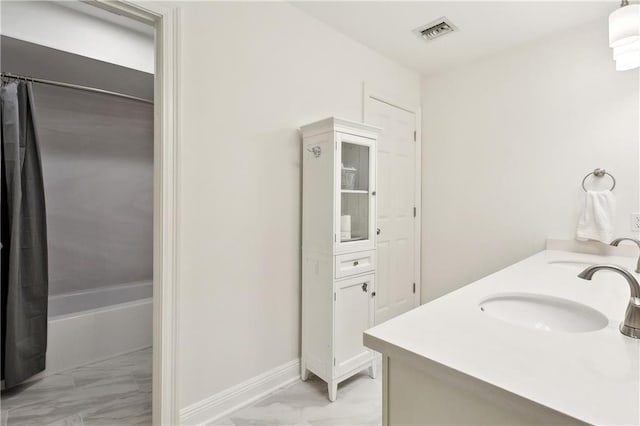 full bathroom featuring visible vents, a sink, and marble finish floor
