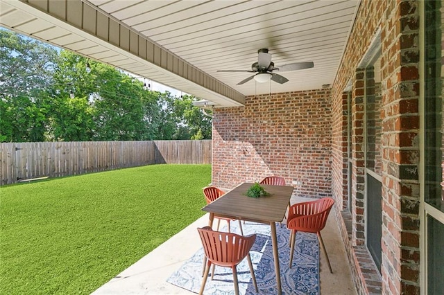 view of patio with a fenced backyard and ceiling fan