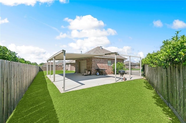 rear view of property with a yard, brick siding, and a fenced backyard