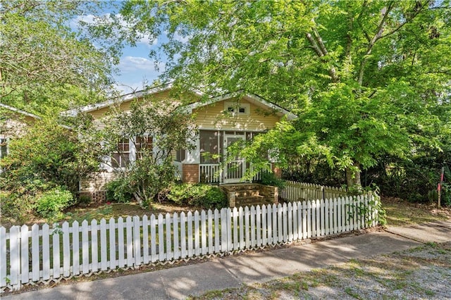 328 E St, Mandeville, LA 70448 - view of front of house with a fenced front yard