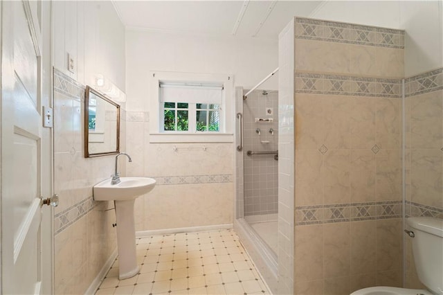 328 E St, Mandeville, LA 70448 - bathroom with crown molding, toilet, tile walls, and tiled shower