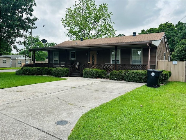 single story home with covered porch and a front lawn