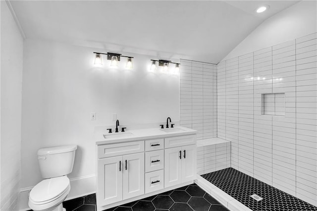 180002 Franklin Ave, New Orleans, LA 70117 - bathroom with vaulted ceiling, tile patterned floors, double vanity, recessed lighting, and a tile shower