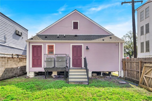 180002 Franklin Ave, New Orleans, LA 70117 - rear view of property with a fenced backyard, a deck, and roof with shingles