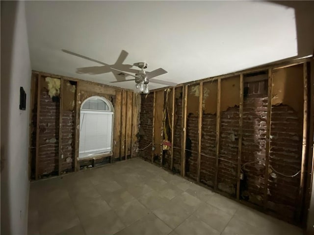 wine cellar featuring a ceiling fan and tile patterned flooring