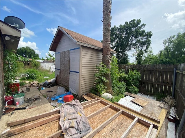 view of shed with a fenced backyard