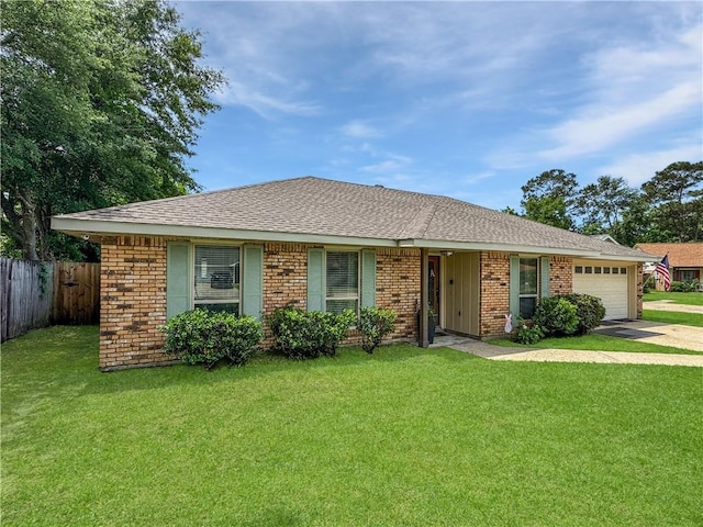 ranch-style home featuring a front lawn, fence, brick siding, concrete driveway, and an attached garage
