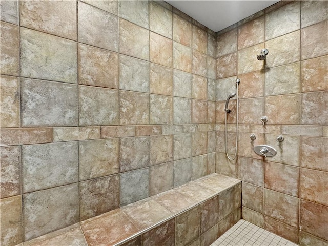 full bathroom featuring a tile shower