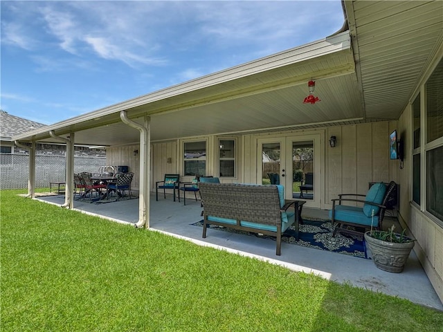 view of patio / terrace featuring fence, outdoor lounge area, and french doors