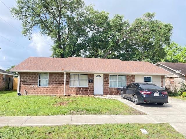 222 Adonis Way, Terrytown, LA 70056 - ranch-style house with a front lawn, brick siding, and concrete driveway