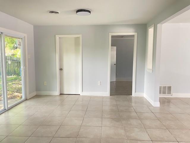 222 Adonis Way, Terrytown, LA 70056 - spare room featuring light tile patterned floors and baseboards