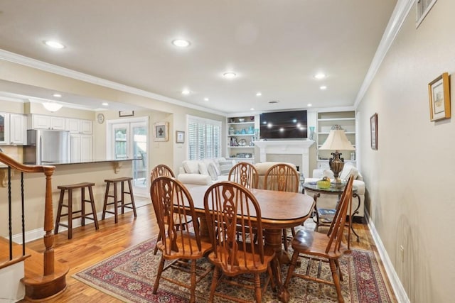 1500 W Esplanade Ave Unit 22B, Kenner, LA 70065 - dining space featuring recessed lighting, baseboards, ornamental molding, and light wood-style floors