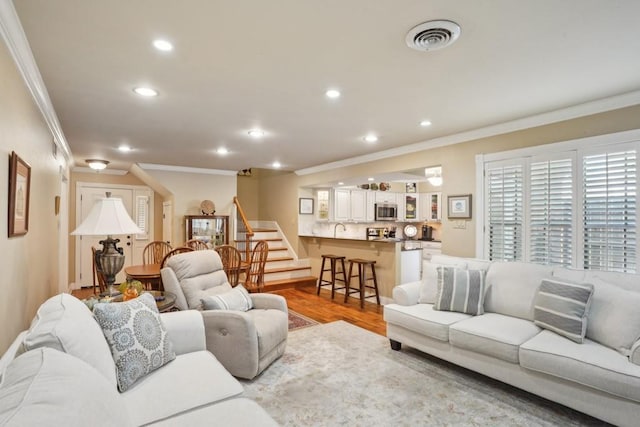 1500 W Esplanade Ave Unit 22B, Kenner, LA 70065 - living room with crown molding, recessed lighting, and visible vents