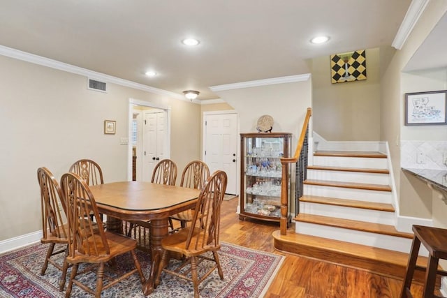 1500 W Esplanade Ave Unit 22B, Kenner, LA 70065 - dining space with visible vents, recessed lighting, crown molding, and wood finished floors