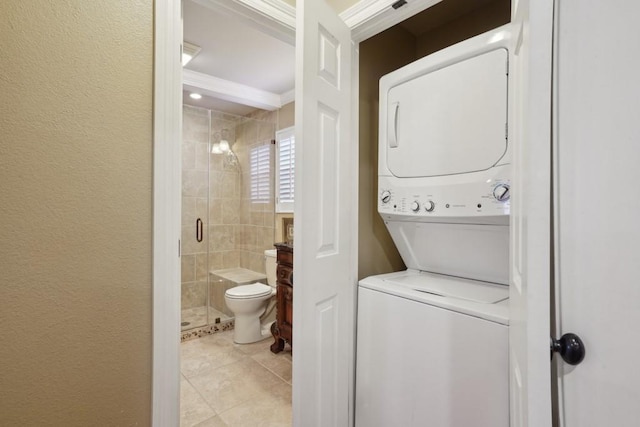 1500 W Esplanade Ave Unit 22B, Kenner, LA 70065 - washroom featuring laundry area, stacked washing maching and dryer, and light tile patterned flooring