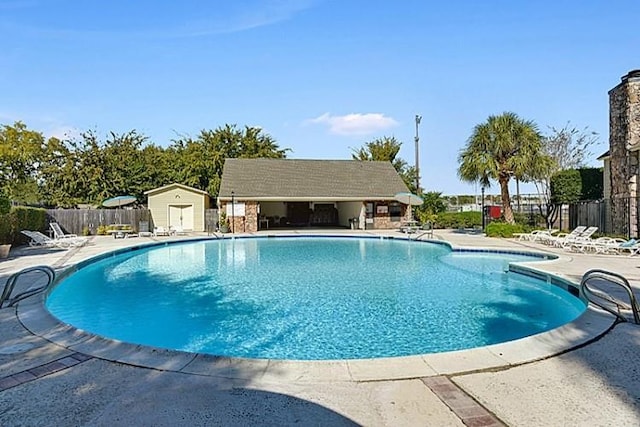 1500 W Esplanade Ave Unit 22B, Kenner, LA 70065 - community pool featuring an outdoor structure, a patio area, and fence