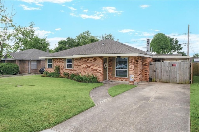 202 River Point Dr, Destrehan, LA 70047 - single story home featuring a chimney, brick siding, fence, a front lawn, and a shingled roof