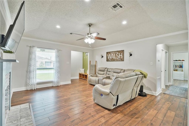 202 River Point Dr, Destrehan, LA 70047 - living room featuring visible vents, a ceiling fan, hardwood / wood-style flooring, and ornamental molding