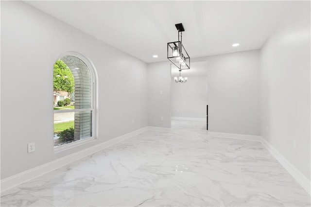736 Glouster Pl, Gretna, LA 70056 - empty room featuring recessed lighting, marble finish floor, baseboards, and a chandelier