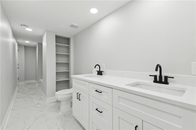736 Glouster Pl, Gretna, LA 70056 - bathroom featuring visible vents, a sink, and marble finish floor