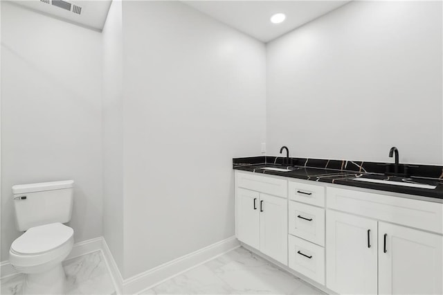 736 Glouster Pl, Gretna, LA 70056 - full bath featuring a sink, baseboards, toilet, and marble finish floor
