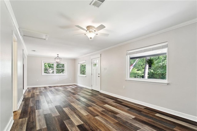 spare room with crown molding, baseboards, visible vents, and dark wood-style floors