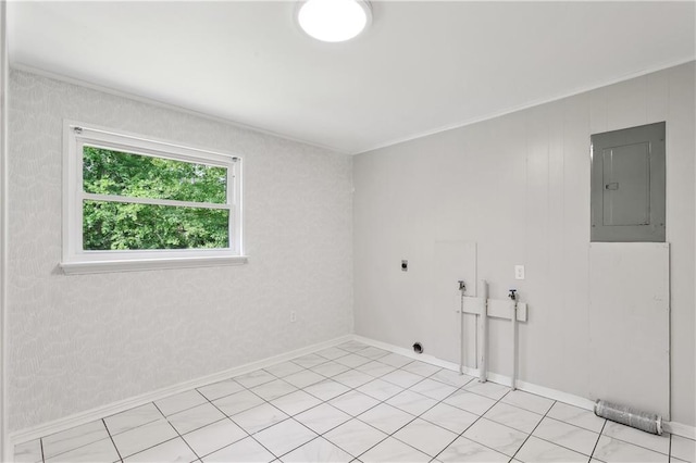 empty room featuring baseboards, light tile patterned flooring, and electric panel