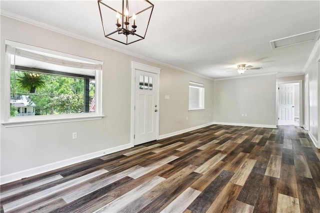 interior space featuring dark wood-type flooring, ornamental molding, and baseboards