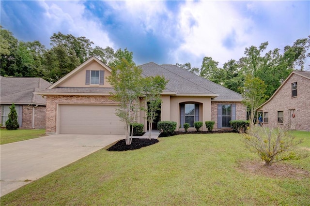 view of front of home featuring a garage, stucco siding, concrete driveway, and a front yard