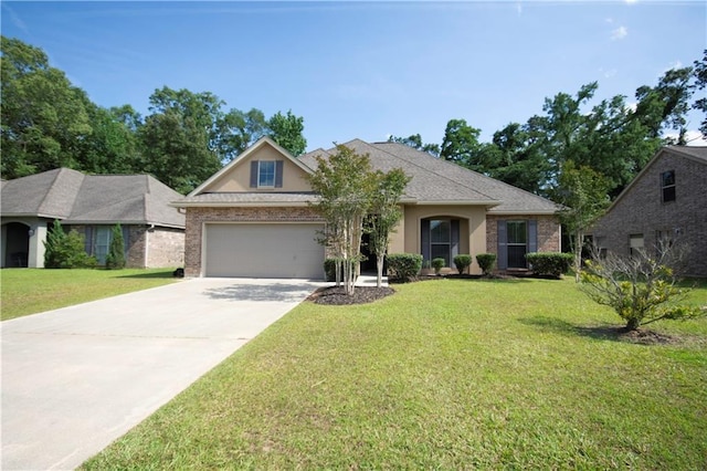 257 Long Leaf Ct, Ponchatoula, LA 70454 - view of front of property with an attached garage, driveway, a front yard, and stucco siding