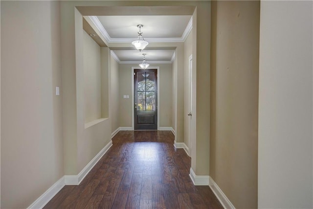 entryway featuring baseboards, ornamental molding, and hardwood / wood-style flooring