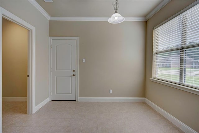 spare room featuring baseboards, ornamental molding, and light tile patterned floors