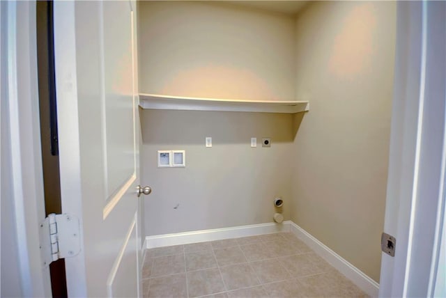 laundry area with laundry area, hookup for a washing machine, baseboards, light tile patterned floors, and hookup for an electric dryer